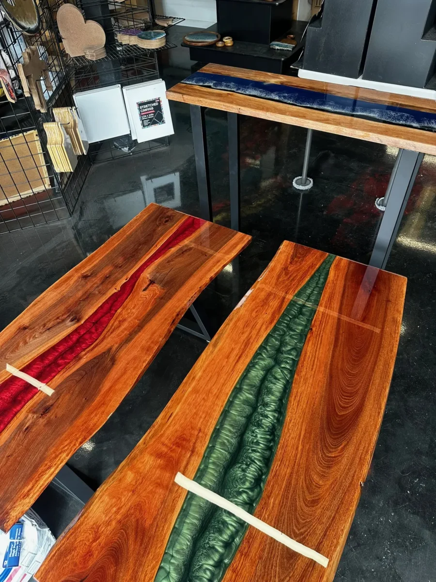 Two river tables, red and green, in the shop